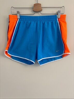 Nike Women’s Blue Shorts with Orange Side Panels